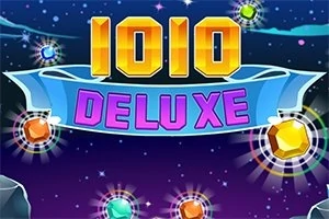 Barevný nápis 1010 DELUXE na tmavém pozadí s hvězdami a zářícími drahokamy