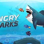 Velký animovaný žralok s otevřenou tlamou pronásleduje barevné ryby na podmořském pozadí s nápisem Angry Sharks