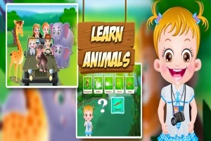 Dívka s fotoaparátem vedle obrázků zvířat a nápisu Learn Animals