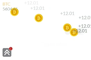 Zlaté mince s logem bitcoinu a číselnými hodnotami na bílém pozadí