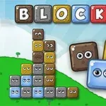 Barevné bloky s očima na zeleném kopci pod modrou oblohou