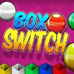 Barevné koule na růžovém pozadí s nápisem BOX SWITCH a řadou barevných krychlí dole