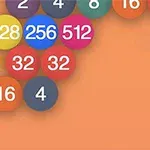 Barevné koule s čísly jako 4, 16, 32, 128, 256 a 512 na oranžovém pozadí
