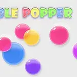 Barevné bubliny různých velikostí na šedém pozadí s nápisem BUBBLE POPPER nahoře