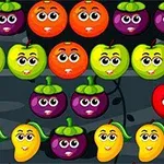 Barevné kreslené ovoce s obličeji v mřížce na tmavém pozadí