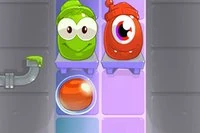 Ve hře Candy Monsters hráči krmí monstra správnými barvami cukrovinek