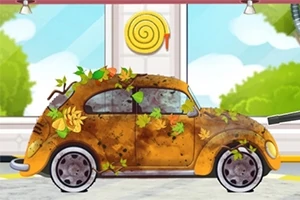 Staré auto pokryté blátem a podzimními listy stojí v moderní garáži s malířskou dekorací na stěně