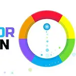 Barevný kruh s nápisem COLOR SPIN a modrou kuličkou uprostřed