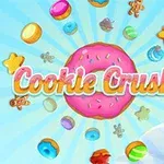 Barevné sušenky, kobliha a cukrovinky se vznášejí na modrém pozadí s nápisem Cookie Crush 2 uprostřed