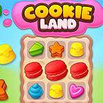 Barevné sušenky a sladkosti různých tvarů na hrací ploše s nápisem Cookie Land