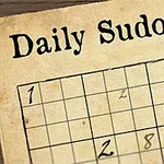 Papírové sudoku s perem a nápisem Daily Sudoku v horní části