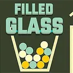 Nápis FILLED GLASS nad sklenicí plnou barevných kuliček na tmavém pozadí