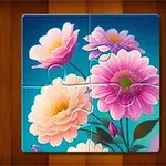 Puzzle se čtyřmi dílky zobrazující růžové a oranžové květiny na modrém pozadí