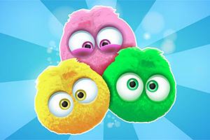 Tři chlupaté, barevné kuličky s velkýma očima na modrém pozadí