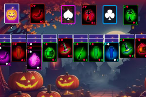 Karetní hra s halloweenskými motivy, dýněmi a temným podzimním pozadím