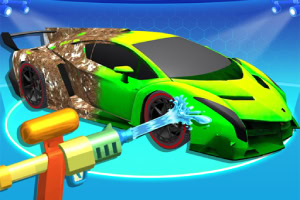 Zelené auto je očišťováno proudem vody z vodní pistole