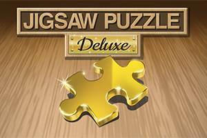 Zlatý dílek puzzle na dřevěném podkladu s nápisem Jigsaw Puzzle Deluxe