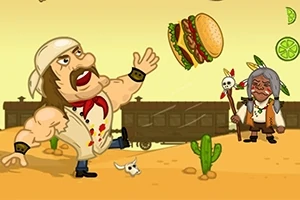 Silný muž v bílém šátku na hlavě hází hamburger na poušti, zatímco starší muž s indiánským vzhledem stojí poblíž kaktusů a vlaku