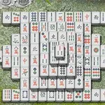 Hra mahjong s dlaždicemi rozloženými na kamenném povrchu s bambusovými listy v rozích