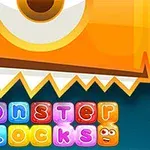 Barevné bloky s písmeny tvořícími nápis monster blocks pod oranžovým tvarem s jedním okem a zubatým okrajem