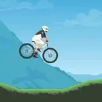 Cyklista na horském kole skáče přes zelený kopeček na pozadí modrých hor