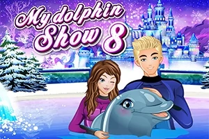 Dva kreslení trenéři v neoprenech s delfínem v zasněžené zimní scéně před modrou pohádkovou budovou