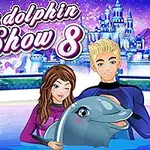 Dva kreslení trenéři v neoprenech s delfínem v zasněžené zimní scéně před modrou pohádkovou budovou