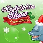 Delfín s červenou čepicí Santa Clause na zeleném pozadí se sněhovými vločkami a nápisem My dolphin Show Christmas