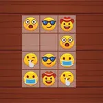 Mřížka s emotikony různých výrazů na dřevěném pozadí
