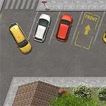 Čtyři auta zaparkovaná na parkovišti, jedno žluté zastavilo v šikmé poloze mimo vyznačené místo s nápisem FRONT