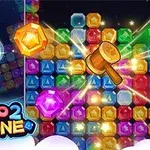Barevné bloky s drahokamy a dřevěné kladívko tvořící efekt záře