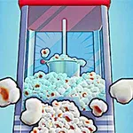 Popcorn praskající z červeného popcornovače na modrém pozadí