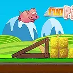 Růžové prase letí ve vzduchu nad krajinou s horami, slámovými balíky a dřevěnou rampou