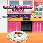Kreslená postava kuchařky stojí vedle kuchyňské linky s nápisem Saras Cooking Class a talířem s dezertem na stole