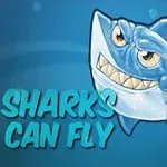 Kreslený modrý žralok s širokým úsměvem a nápisem SHARKS CAN FLY na modrém pozadí