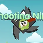 Kreslený ninja v zeleném obleku s červenou čelenkou letící před horou na pozadí, s nápisem „Shooting Ninja“ nahoře