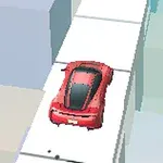 Červené auto na úzké bílé silnici mezi geometrickými bloky