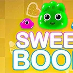 Barevné želé postavičky na žlutém pozadí s nápisem SWEET BOOM