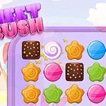 Barevné sladkosti a čokoládové kostky na herní ploše s nápisem Sweet Crush nahoře