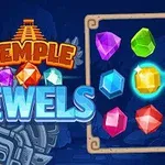 Nápis Temple Jewels s barevnými drahokamy na modrém pozadí