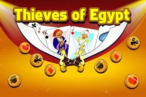 Hrací karty s egyptskými motivy obklopené mincemi na zlatém pozadí