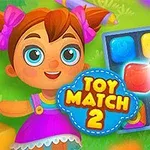 Malá kreslená dívka s velkýma modrýma očima a červenými mašlemi stojí vedle herního pole s barevnými kostkami a nápisem Toy Match 2