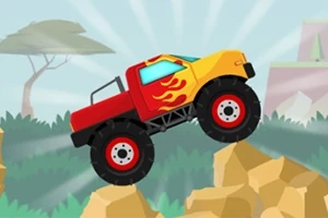 Červené a žluté monster truck auto s plameny na bocích jede přes kamenitou překážku na pozadí s africkou krajinou