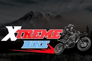 Název Xtreme Bike v červeno-modré barvě s grafikou motocyklisty na pozadí horské krajiny
